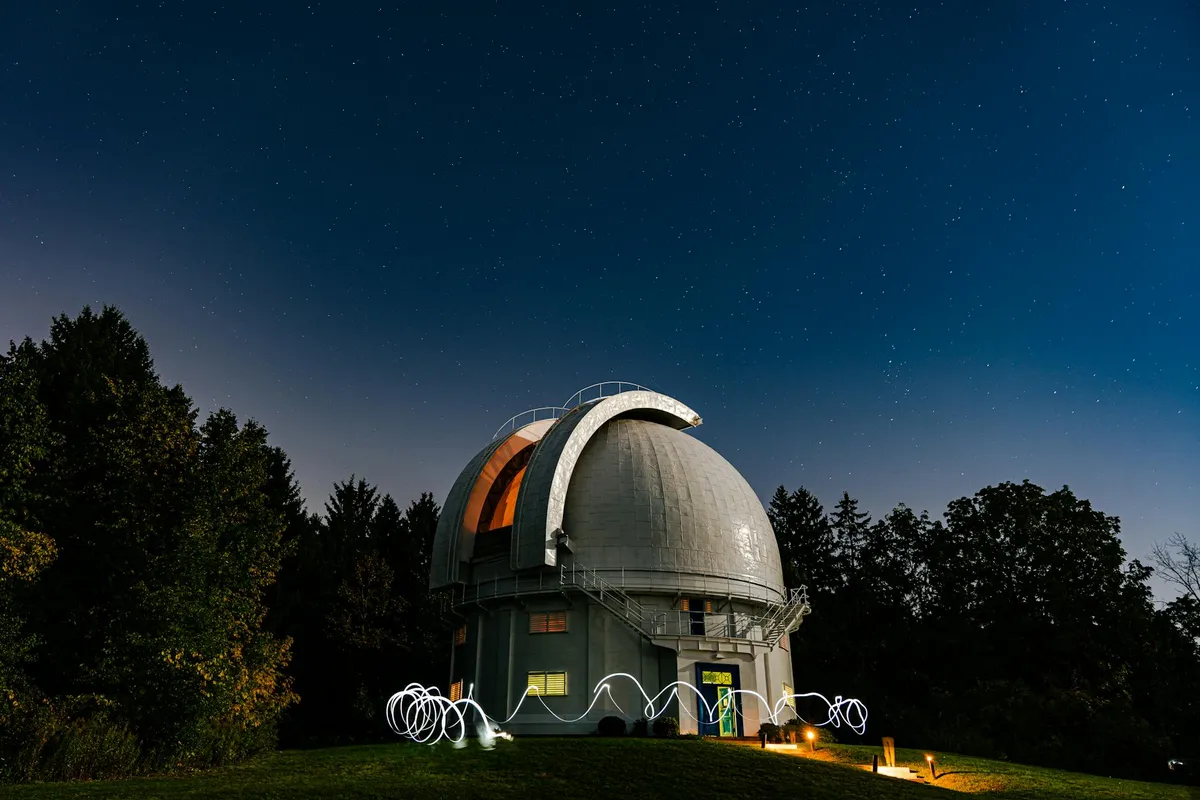 An observatory telescope at night